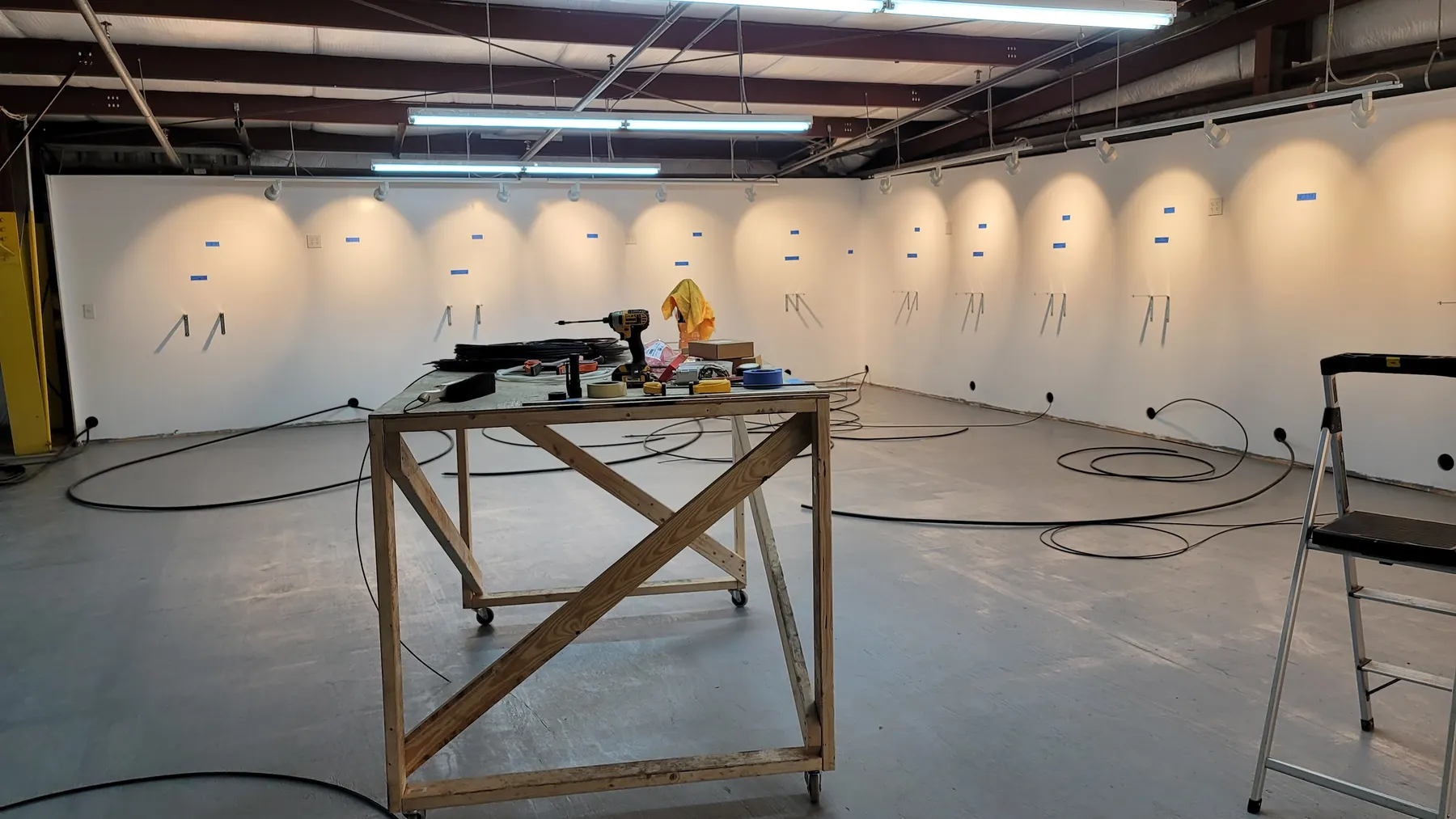 Training still: work table and wall drops