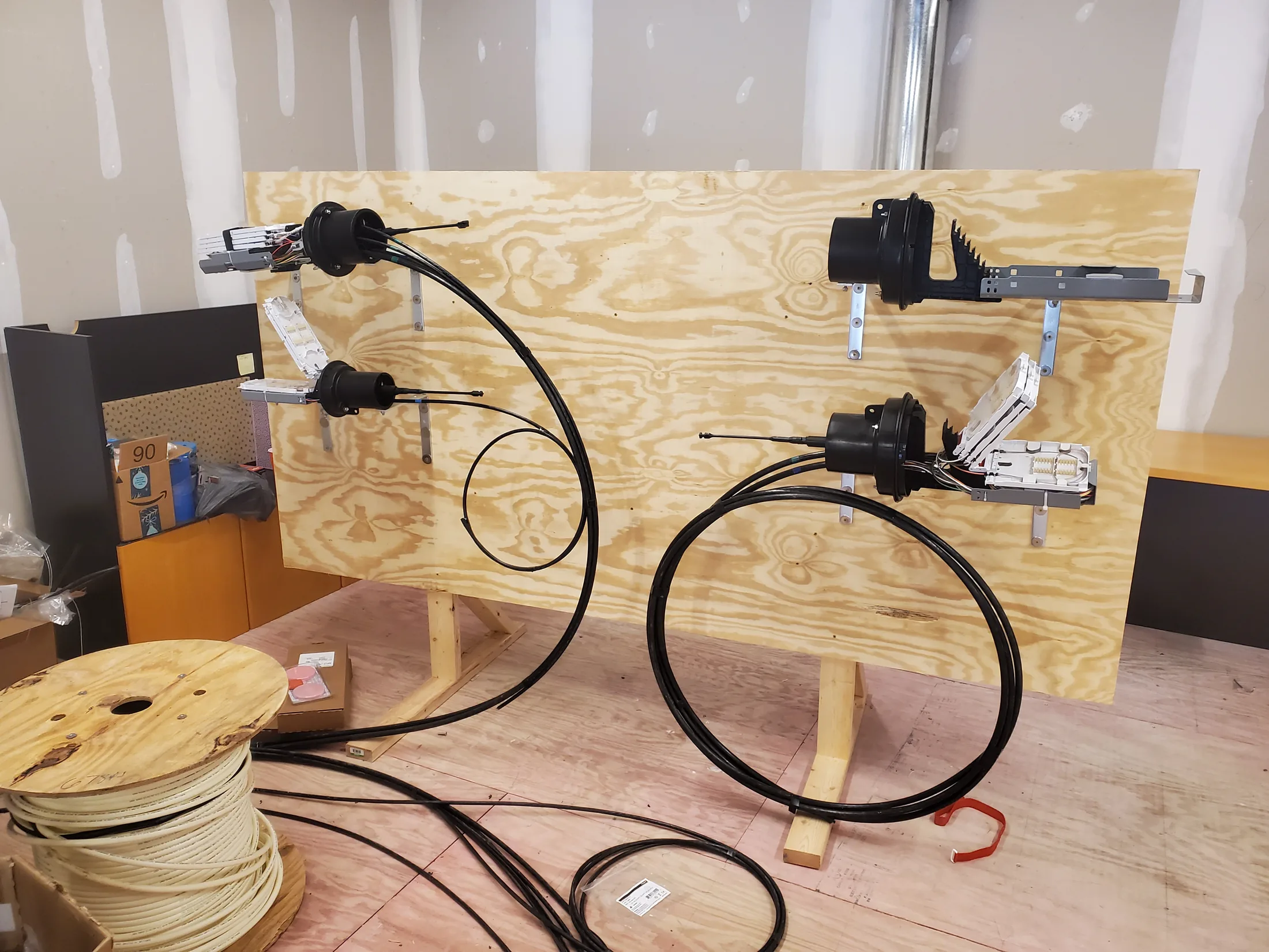 Issued lab still, 2020-05-14: plywood practice board with closures and a cable reel