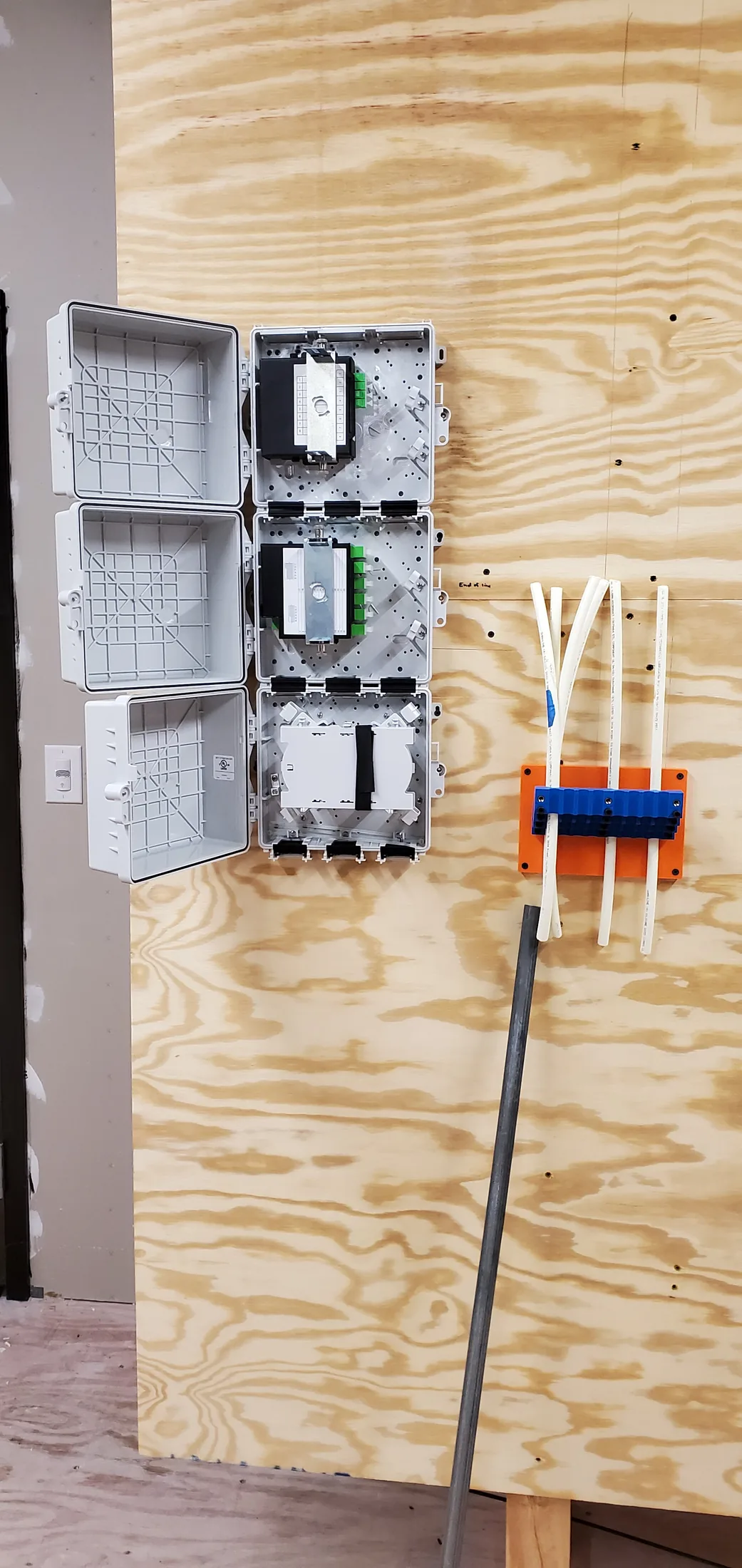 Issued lab still, 2020-05-18: three open enclosures and a drop organizer on plywood