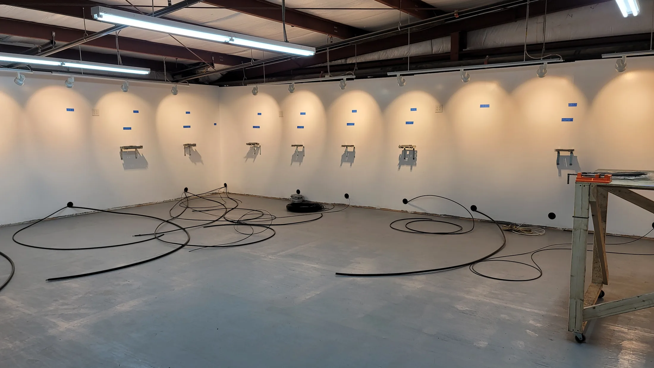 Issued lab still, 2021-01-28: brackets, lighting, mounts; it looks like an art gallery